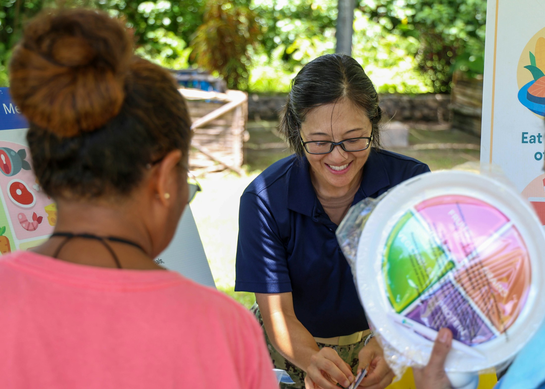 A field health worker engaging with a community member
